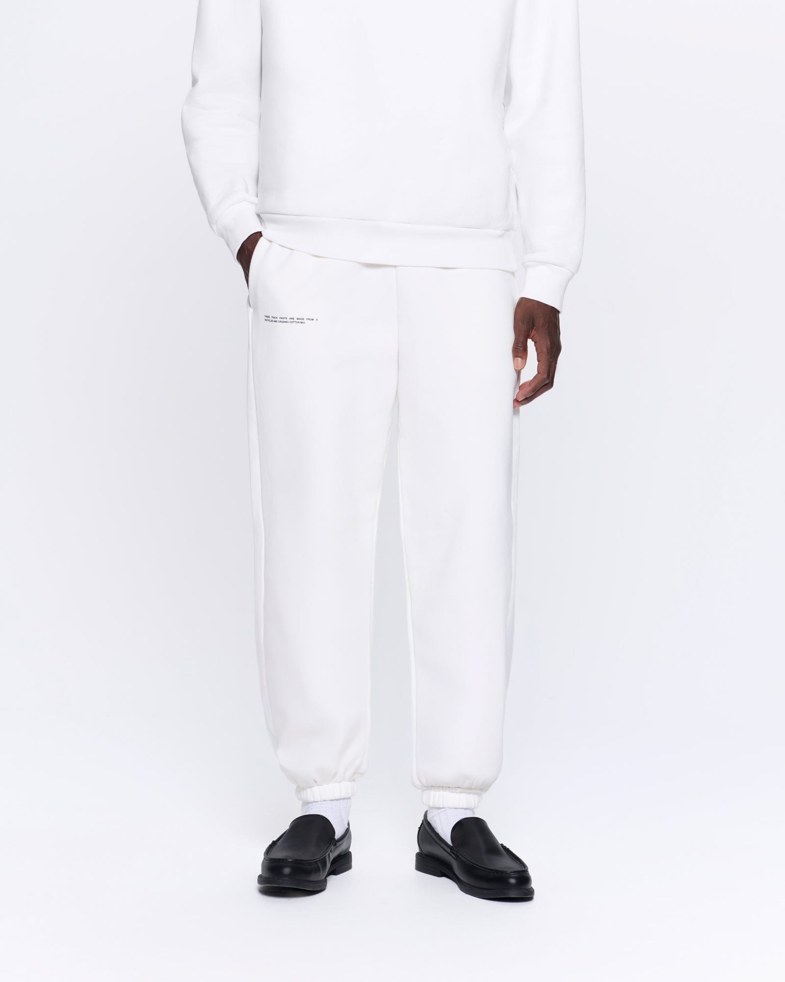 365_HEAVYWEIGHT_TRACK_PANTS_OFF_WHITE_MENS_FRONT-MODEL