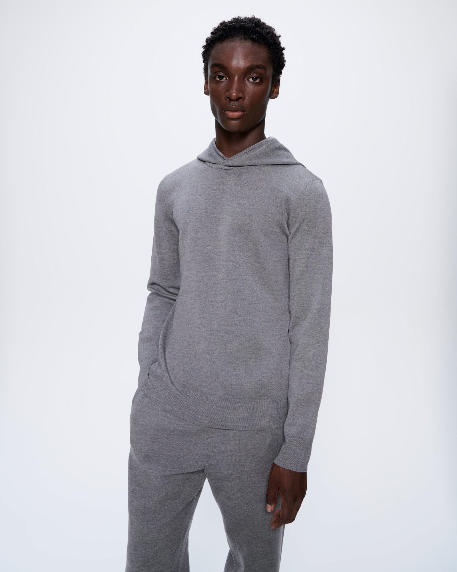 DNA_REGENERATIVE_MERINO_WOOL_HOODIE_GREY_MARL_MENS_FRONT_1