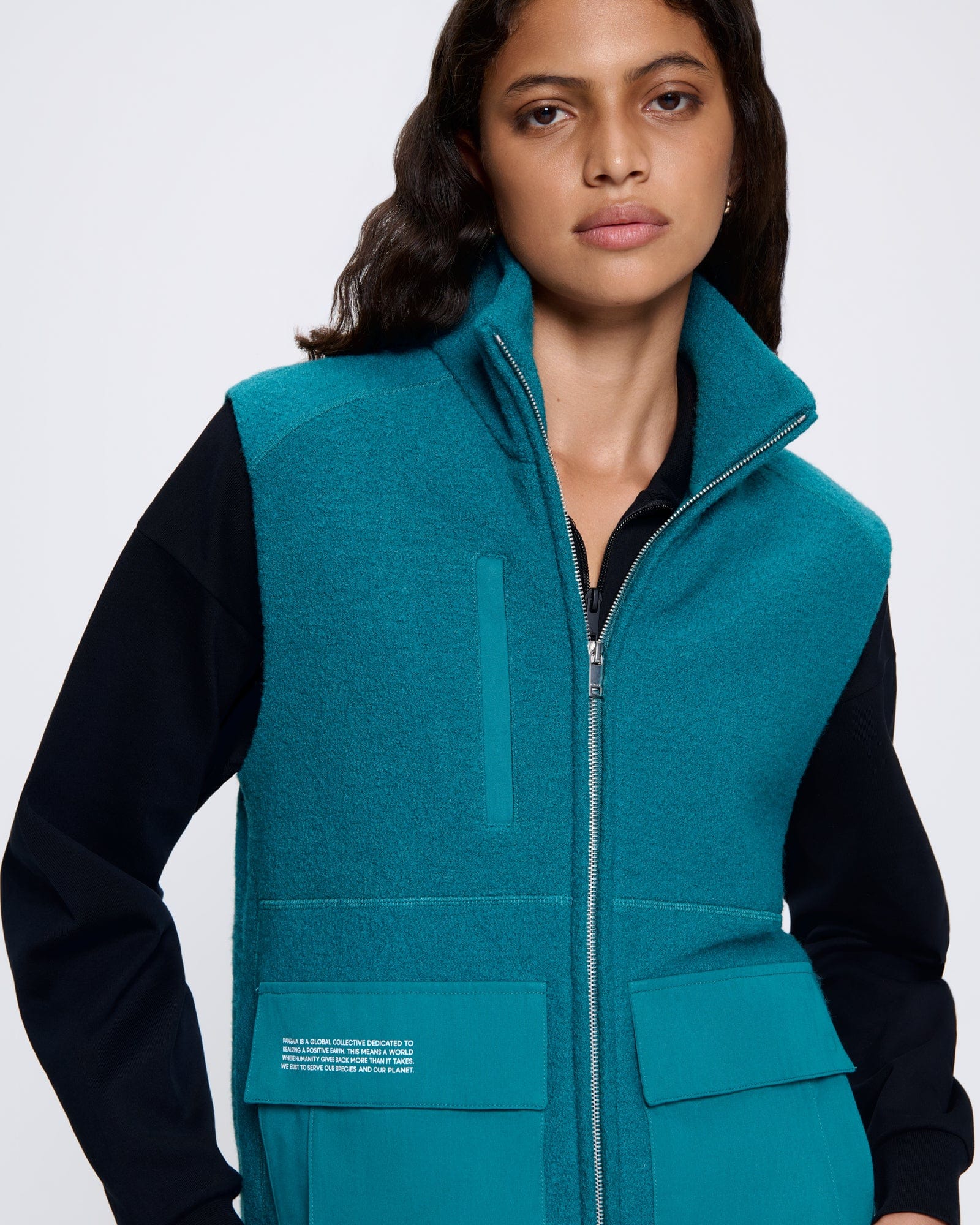 DNA_UTILITY-WOOL-GILET_SCARAB-TEAL_WOMENS_FRONT_1