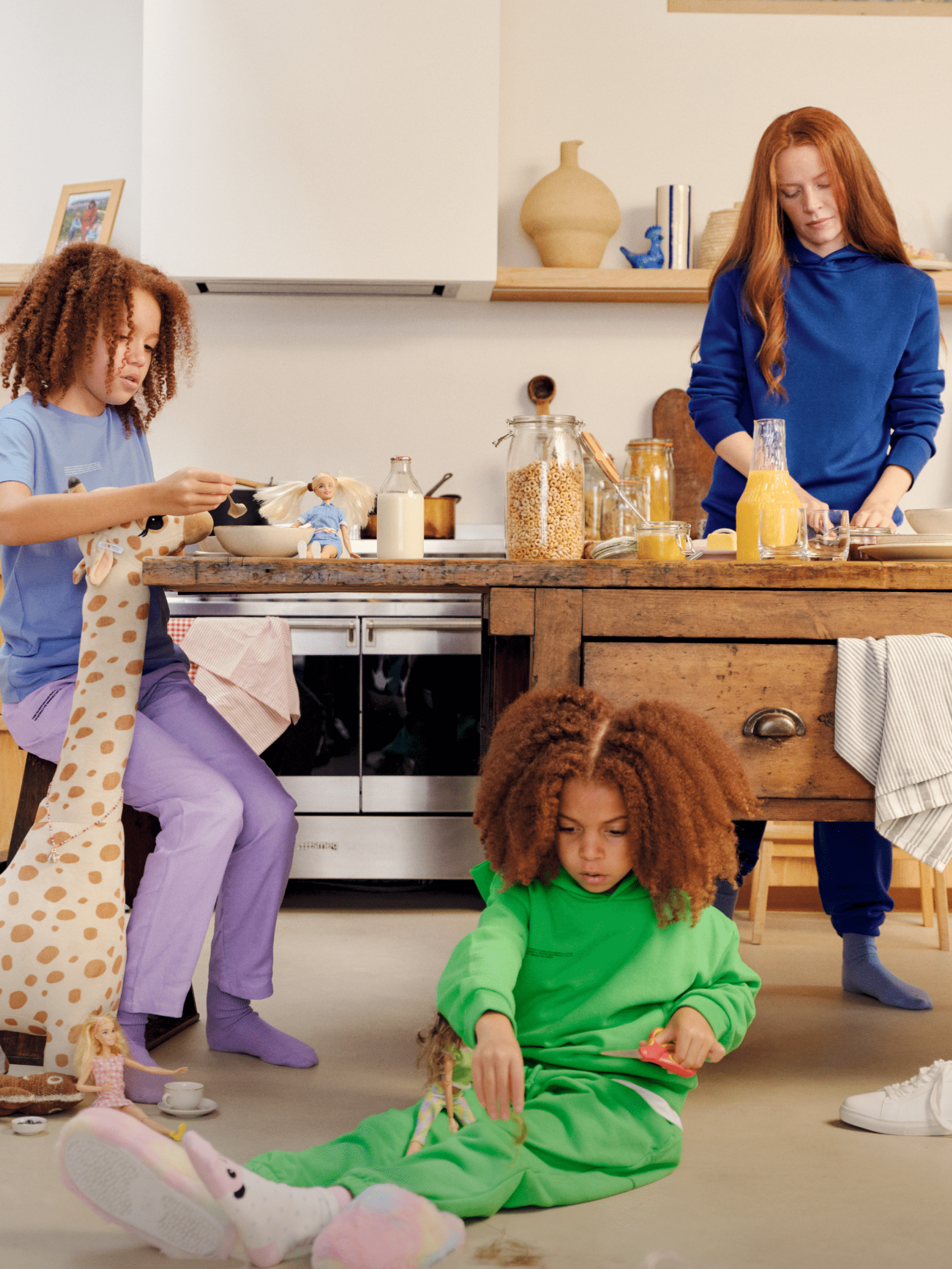 Royal blue youth cotton hoodie & matching sweatpants, green kids' cotton hoodie & sweatpants, light blue tee & purple cotton joggers