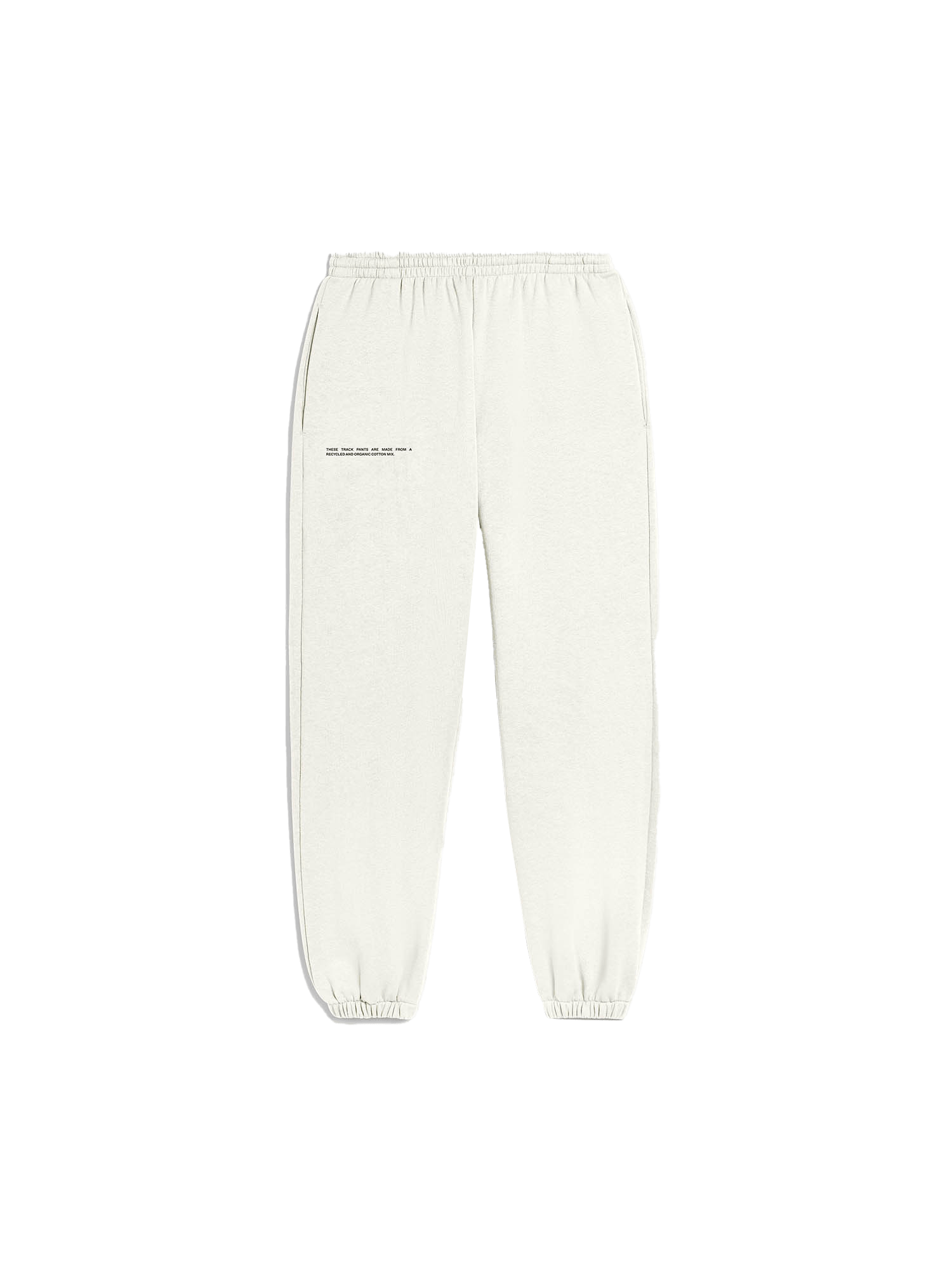 Light cream relaxed fit track pants packshot. Recycled organic cotton blend sweatpants with elasticated waist and ribbed ankle cuffs