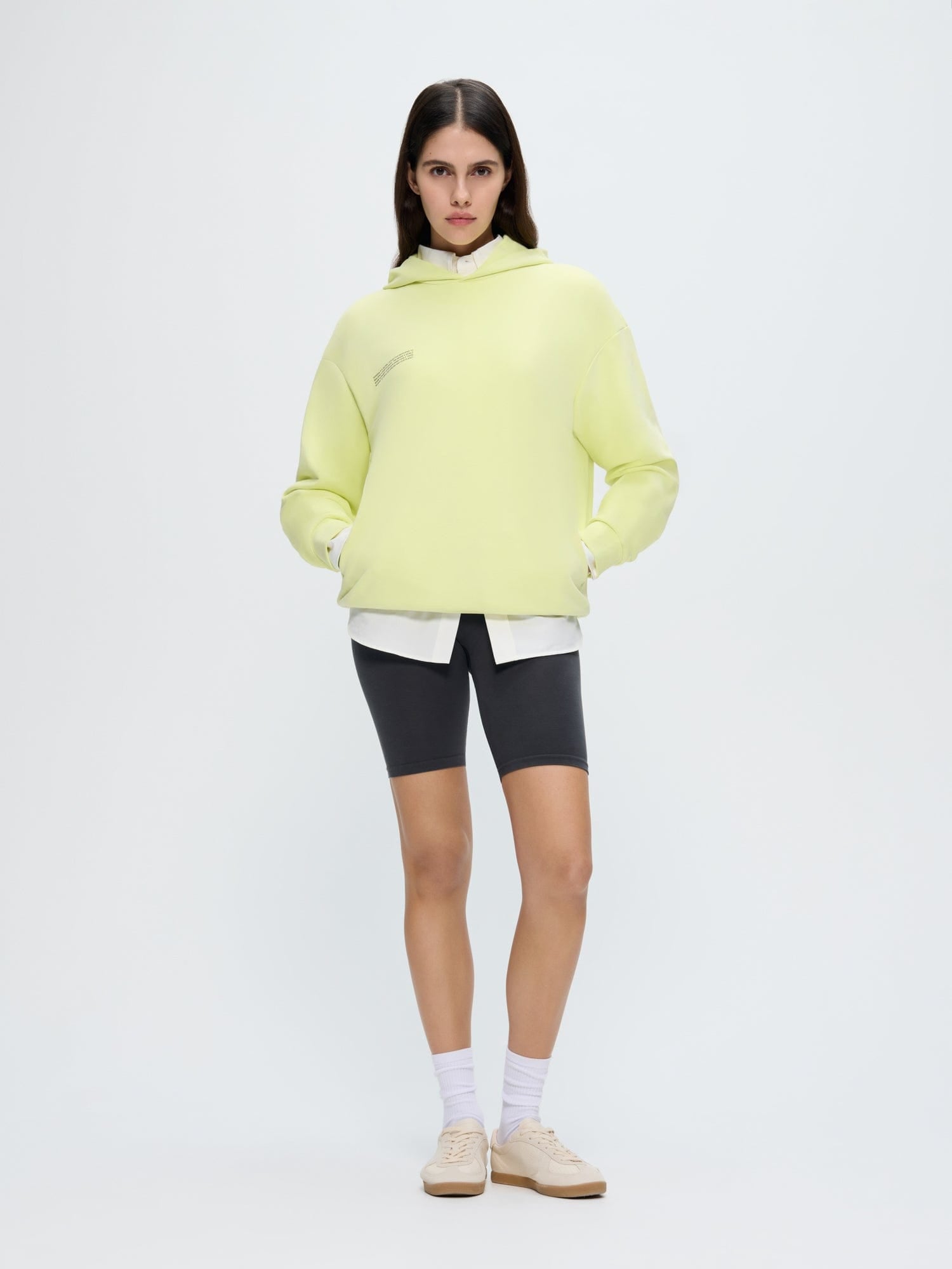 Womens 365 Midweight Hoodie in Soft Lime, organic cotton, oversized boxy fit, kangaroo pockets, worn by model
