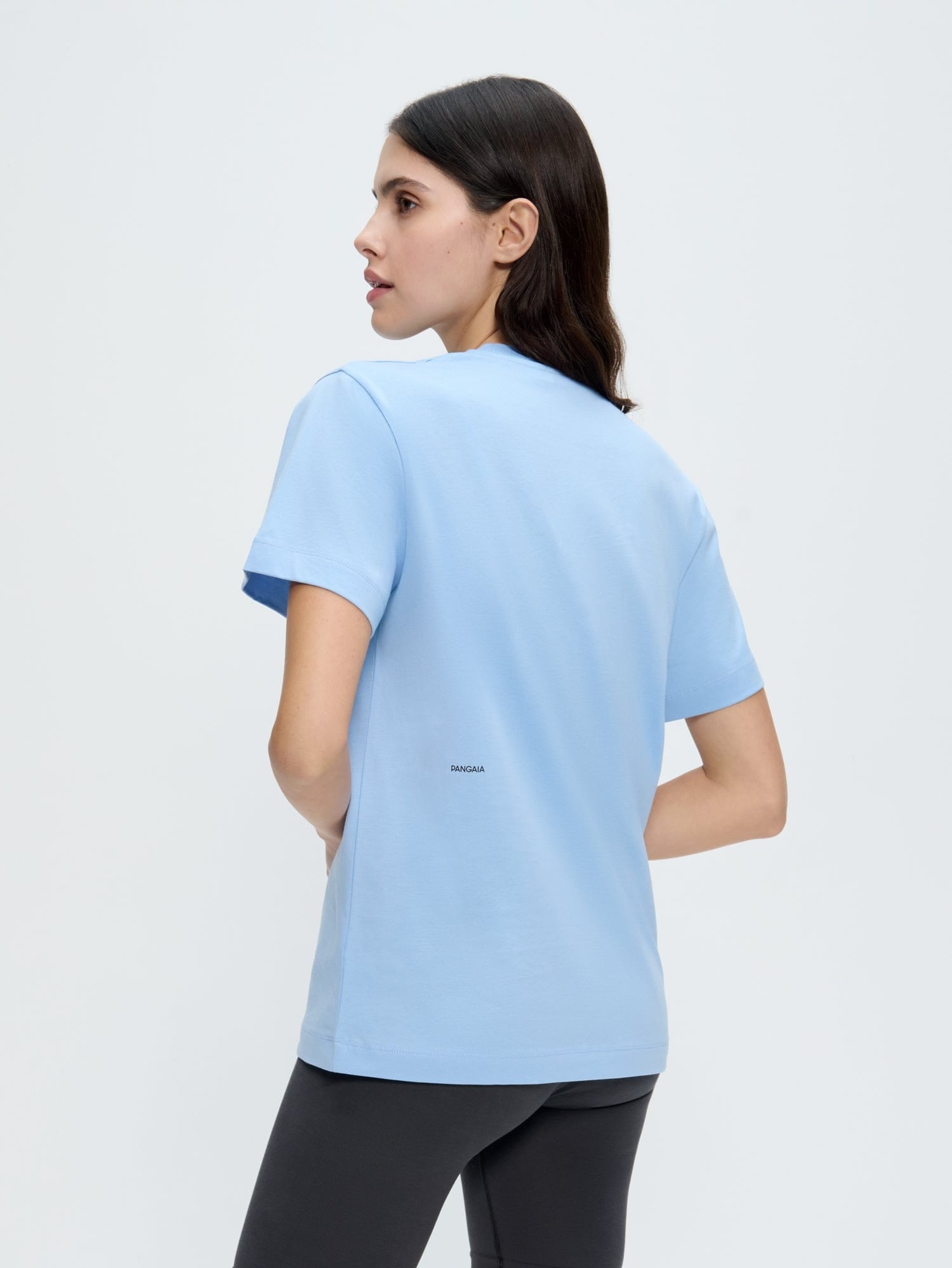 Womens 365 Midweight T-shirt, Dewdrop Blue. Oversized organic cotton crew neck tee with PANGAIA text on back, female model