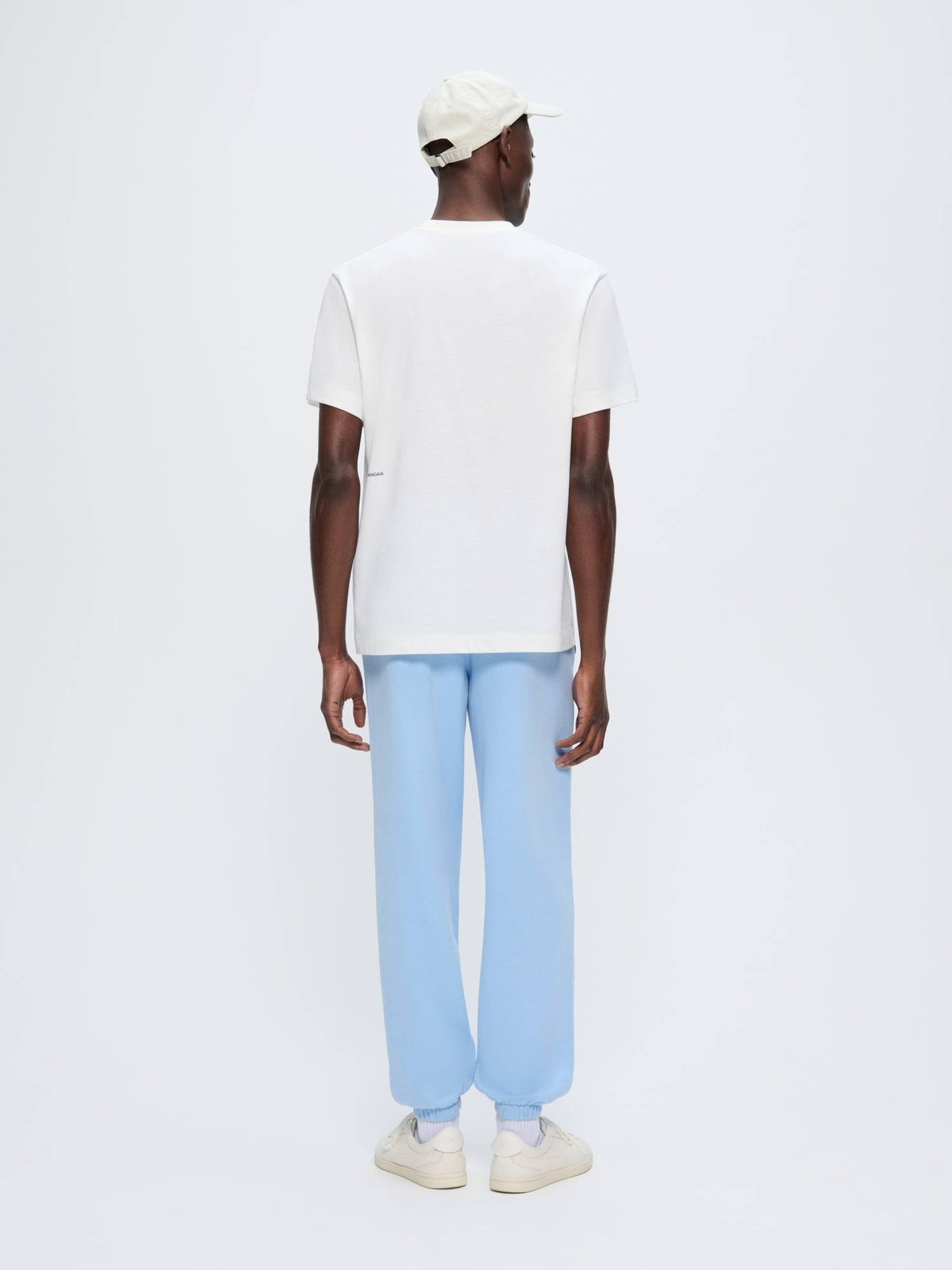 Mens 365 Midweight Dewdrop Blue organic cotton track pants, loose oversized fit, lightweight, cuffed ankles, model from back