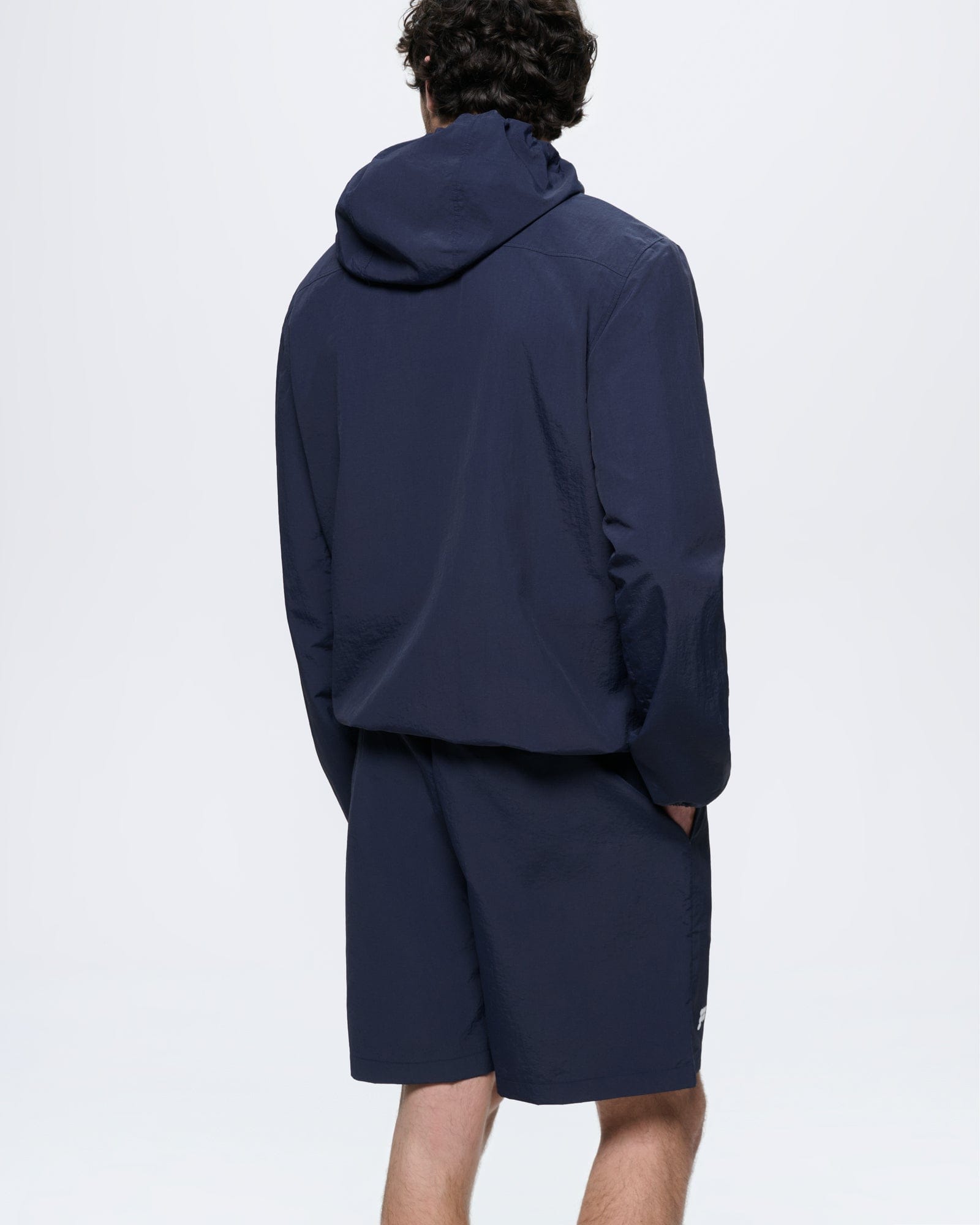 Mens Granite Navy Recycled Nylon Zip Up Hooded Jacket. Regular fit, lightweight polyamide for training & everyday wear, rear view