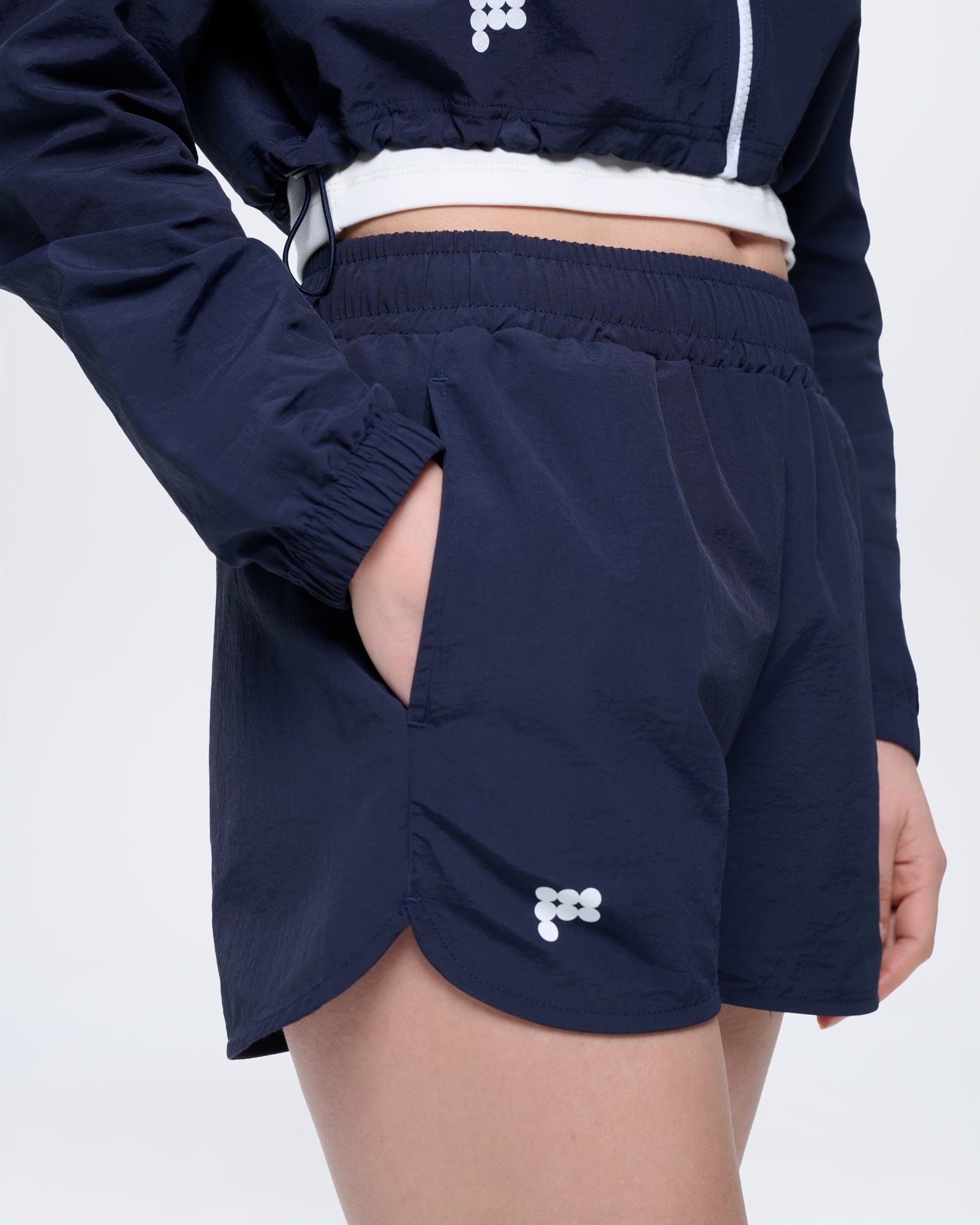 Womens Granite Navy recycled polyamide shorts. Lightweight, regular fit, elasticated waist, side pocket, white logo