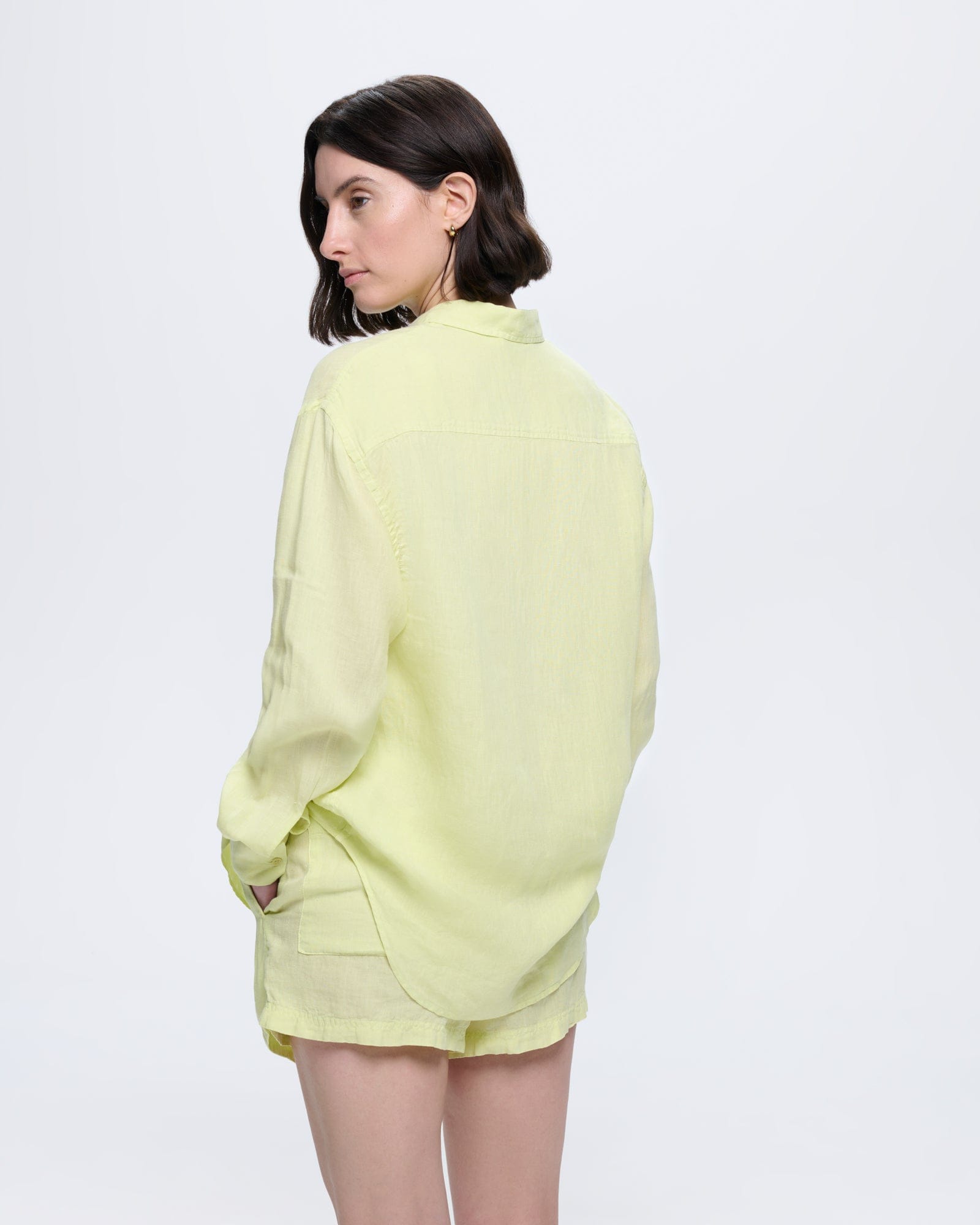 Womens Soft Lime European Flax linen overshirt. Model wears relaxed fit long sleeve shirt with collar and matching shorts
